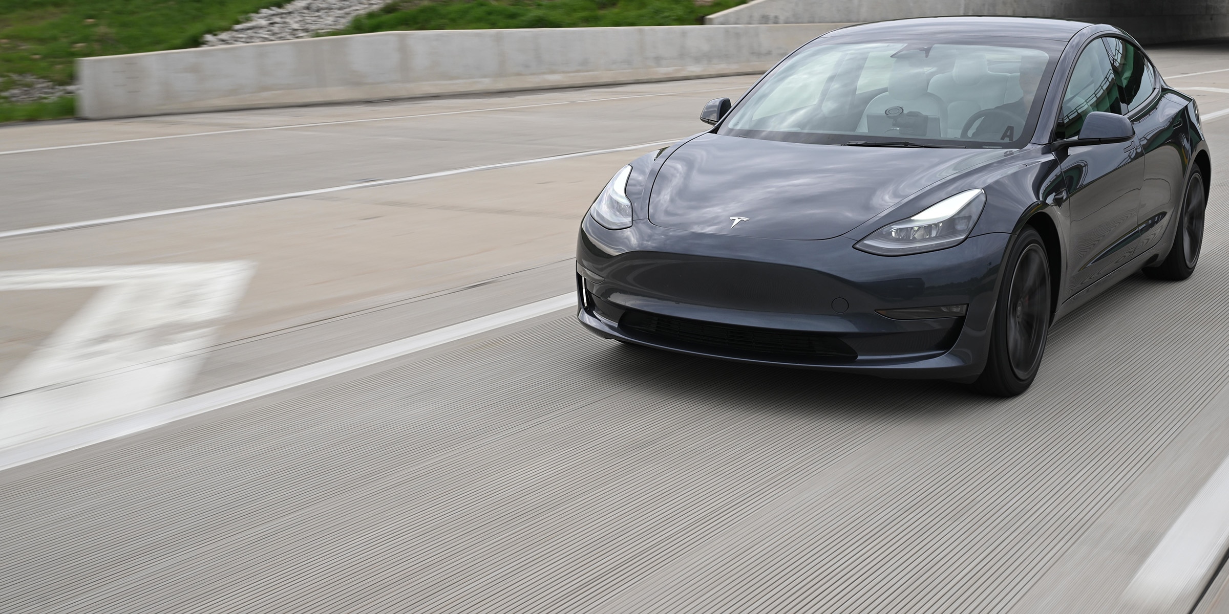 2023 Tesla Model 3 in Motion on Road Testing Fuel Efficient Tires