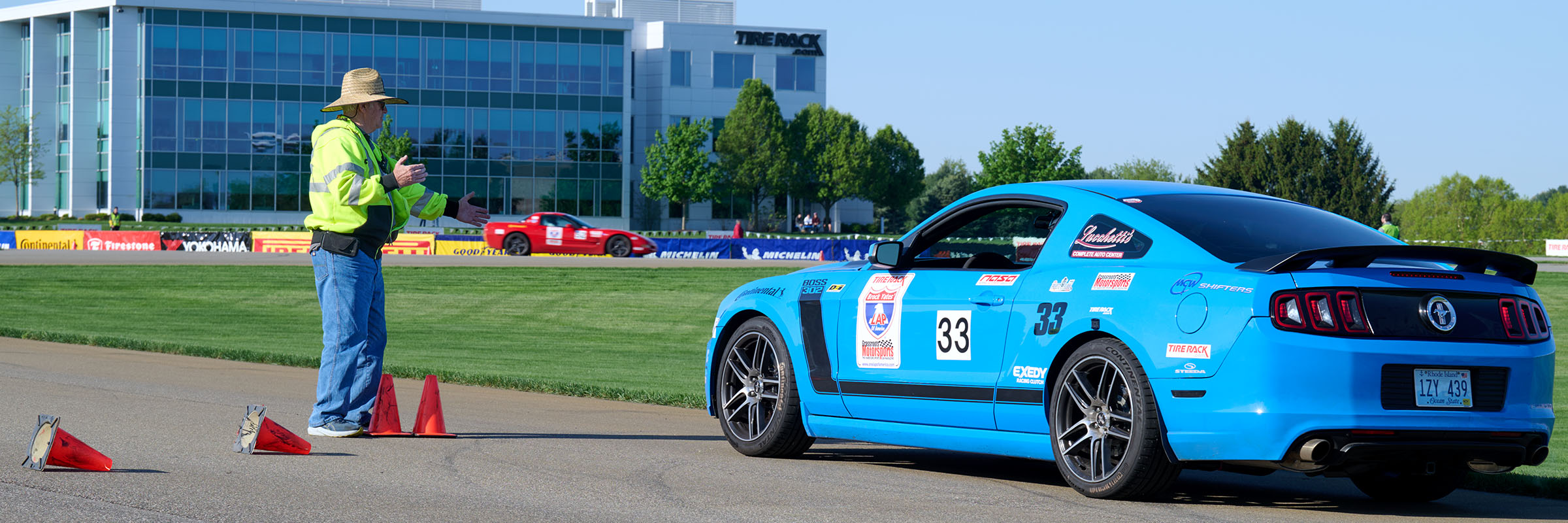 One Lap of America 2025 Event with Starter and Blue Mustang on Tire Rack Track