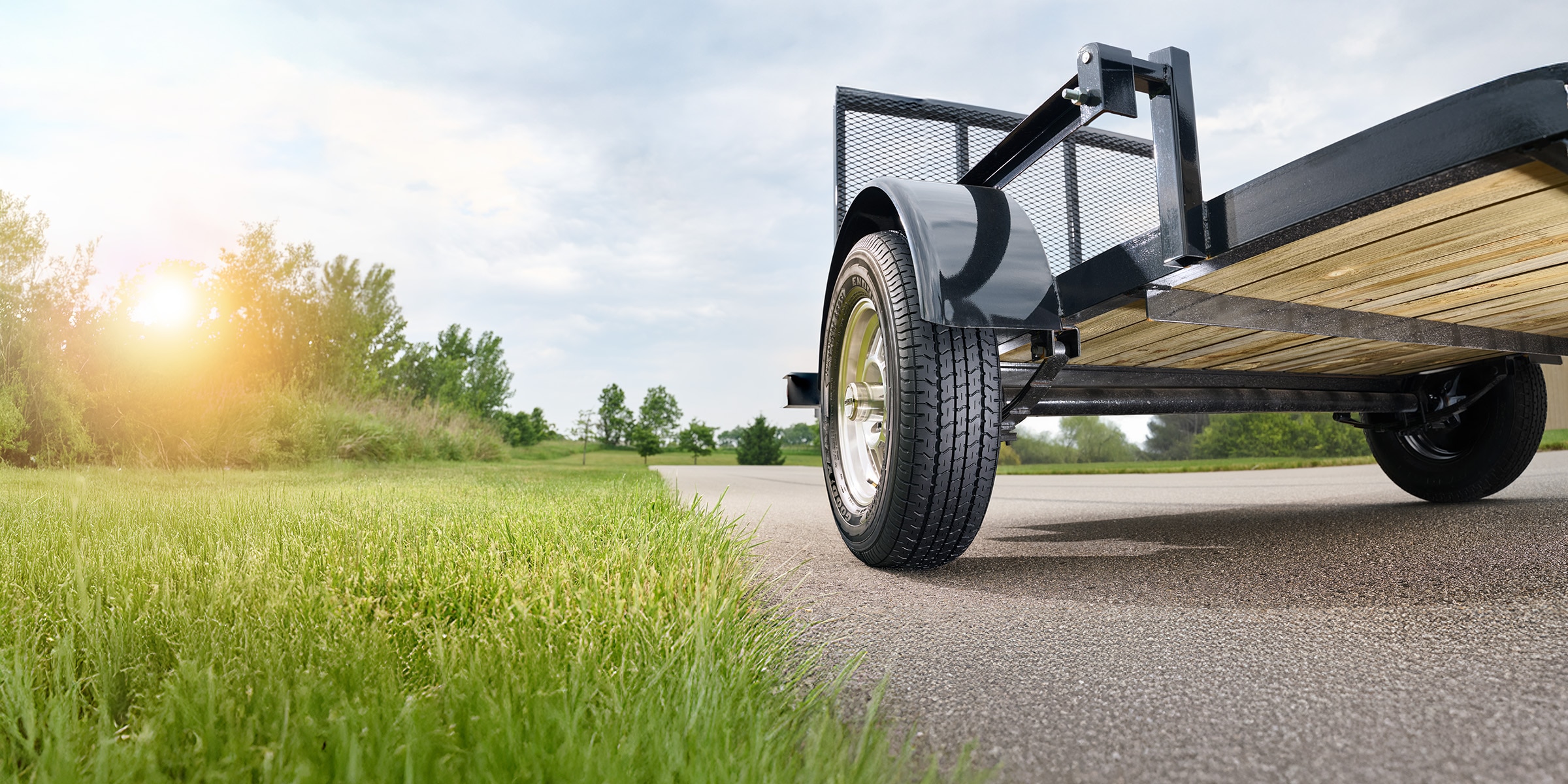 Low-angle view of a trailer on pavement highlighting special use and trailer tire performance.
